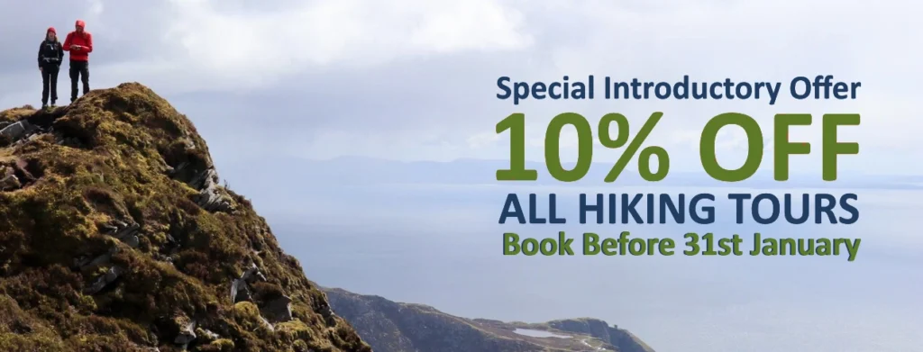 Banner showing 10% OFF hiking tours with hikers standing on top of a hill. 